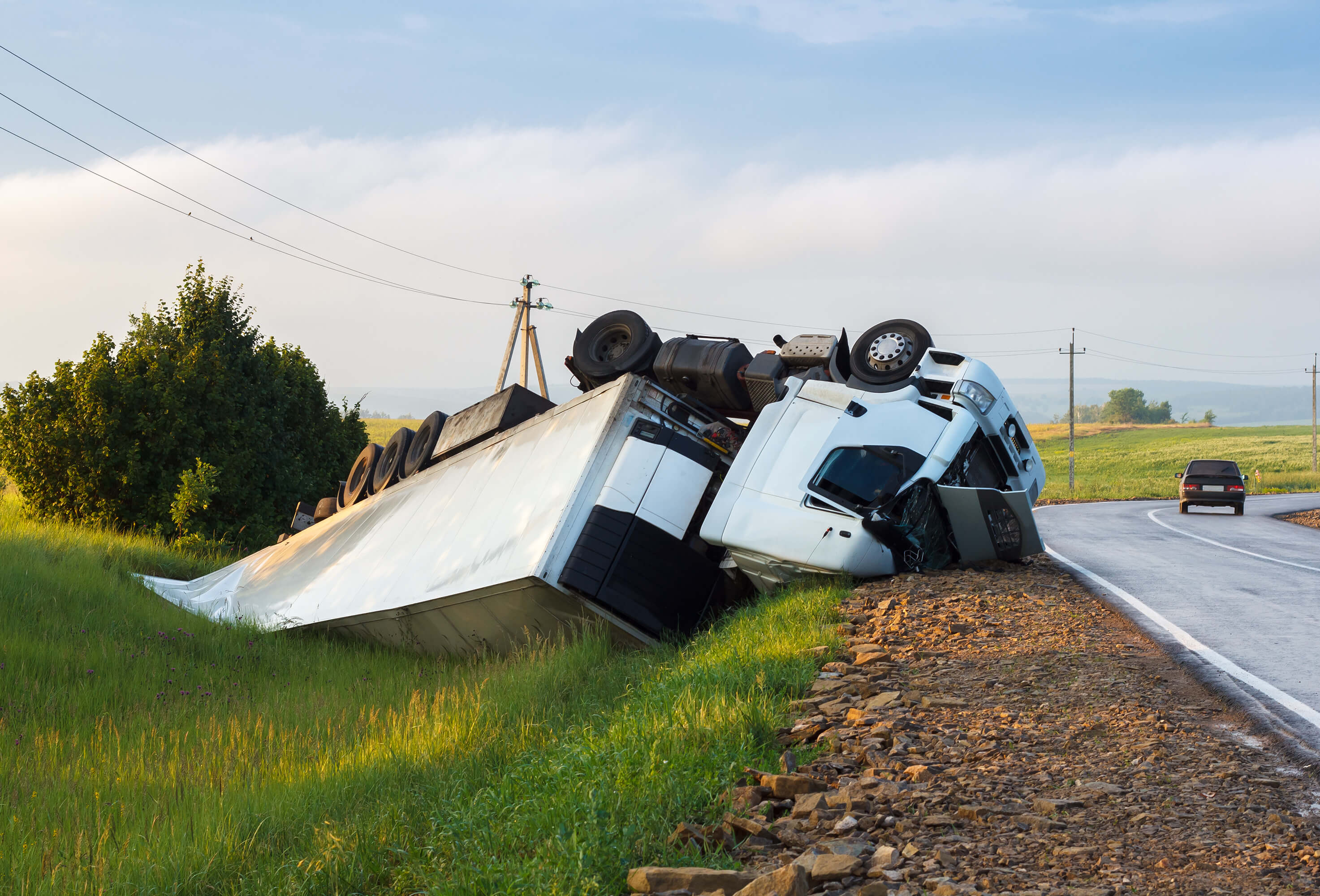 Overturned truck on the site of a road in Georgia